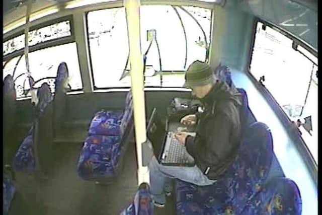 North Yorkshire Police picture of James Allen using Julie Davison's laptop on a bus.