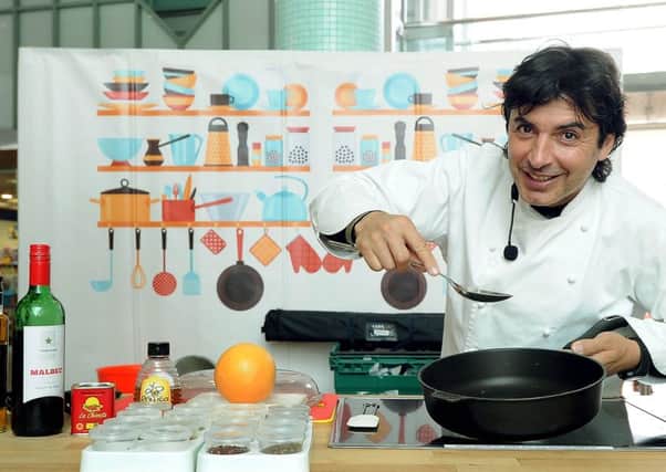 Jean-Christophe Novelli cooking for shoppers in The Merrion Centre, Leeds.