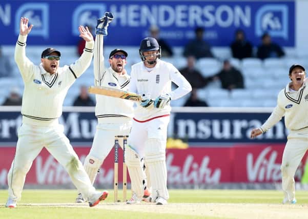 England's Jos Butler is last man out leg before as New Zealand's players turn to celebrate winning the second Test and squaring the series.