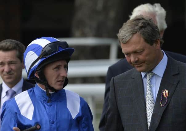 WINNING FEELING: William Haggas, right, talking with jockey Paul Hanagan, returns to the Epsom Derby today 19 years after Shaamit gave the Yorkshire-born trainer a Derby winner at the first attempt.