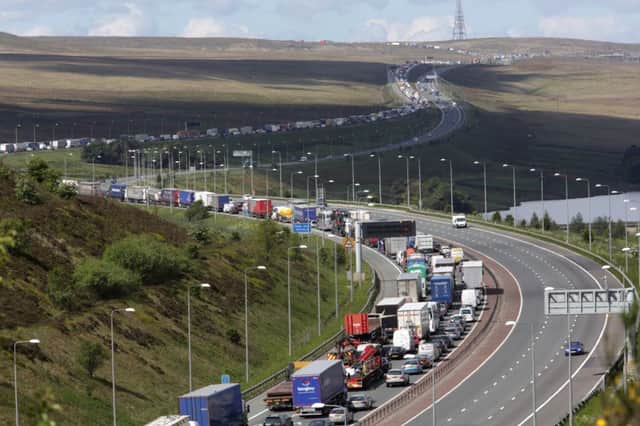 Traffic queues as far as the eye can see on the M62 at Scammonden looking, towards Macherster.