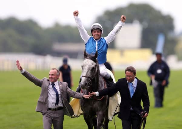 Jockey Maxime Guyon celebrates winning the Queen Anne Stakes on Solow. Picture: David Davies/PA.