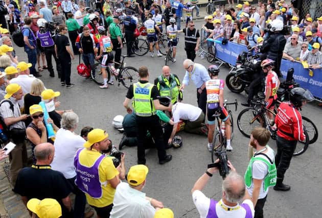 Lizzie Armistead crashes after crossing the finish line to win stage one of the Women's Tour of Britain in Aldeburgh, Suffolk.