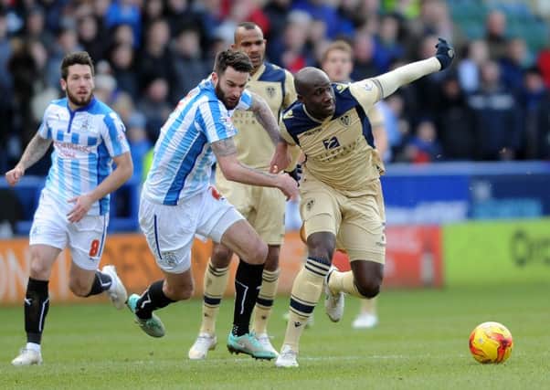 Derby battle: 
Leeds United's Sol Bamba gets away from Huddersfield's David Edgar