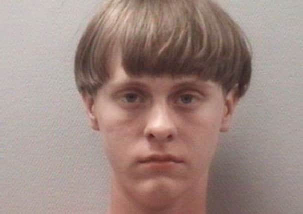 Picture released by the Lexington County (S.C.) Detention Center shows Dylann Roof, 21. Charleston Police identified Roof as the shooter who opened fire during a prayer meeting inside the Emanuel AME Church in Charleston.  (Lexington County (S.C.) Detention Center via AP)