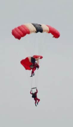 BEST QUALITY AVAILABLE

Handout photo dated 19/06/15 courtesy of Stephen Miller of members of the British Army freefall parachute display team, the 'Red Devils' who were performing at the Whitehaven Air Show on the Cumbrian coast last night, when a team members chute failed to open - leaving a team-mate to catch him in mid-air and bring him to safety. PRESS ASSOCIATION Photo. Issue date: Saturday June 20, 2015. See PA story AIR Devils. Photo credit should read: Stephen Miller/PA Wire

NOTE TO EDITORS: This handout photo may only be used in for editorial reporting purposes for the contemporaneous illustration of events, things or the people in the image or facts mentioned in the caption. Reuse of the picture may require further permission from the copyright holder.