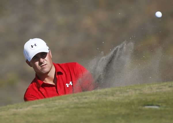 Jordan Spieth hits out of the bunker on the ninth hole during the third round at Chambers Bay