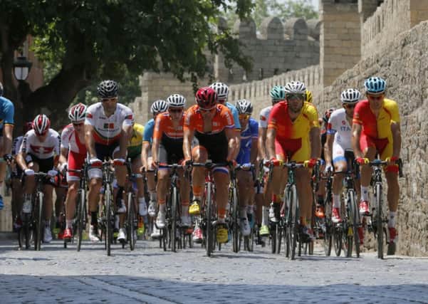 Athletes compete during men's cycling road race in the old city of Baku at the 2015 European Games.