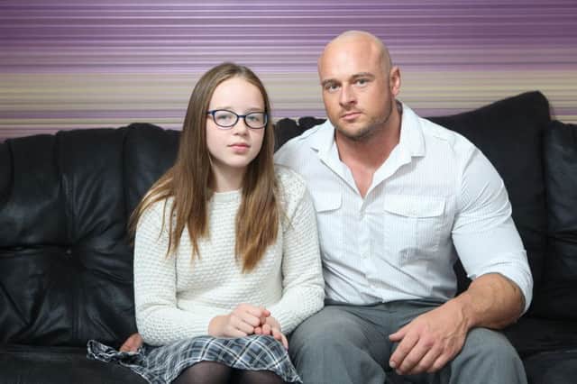 Megan Oldfield with her father James at their home in Pontefract, West Yorkshire.