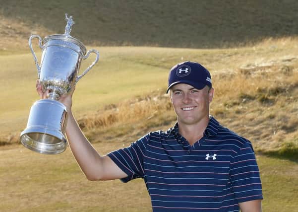 Jordan Spieth holds up the trophy after winning the US Open