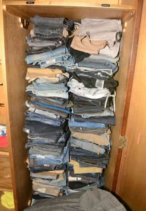 A waredrobe full of designer jeans was found.