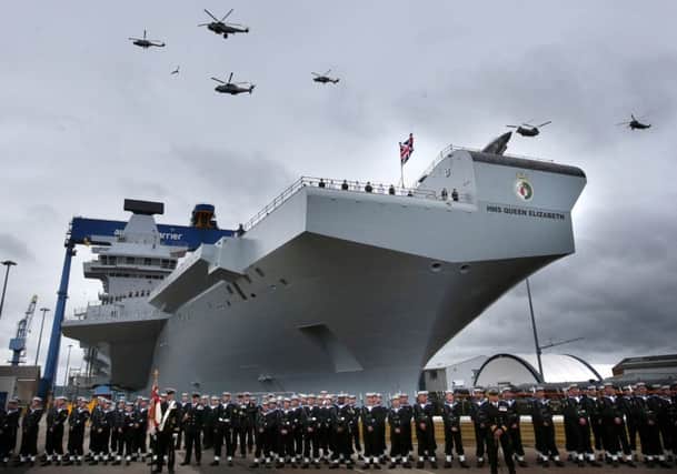 A helicopter flypast at the formal naming ceremony for HMS Queen Elizabeth in Rosyth Dockyard, Fife, in November.
The Civitas report says more spending should be directed on research rather than costly long-term programmes.

Photo: Andrew Milligan/PA Wire