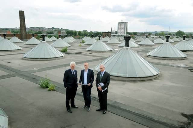 Pictured (left to right) Duncan Wilson, the new Chief Executive of Historic England, Chris Thompson, Managing Director, Citu, the developer who is regenerating Temple Mill, and Sir Laurie Magnus, Chairman, Historic England, during a visit around the former flax mill.
