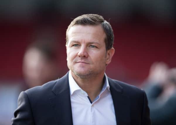 Swindon boss Mark Cooper poised to become next Owls head coach.