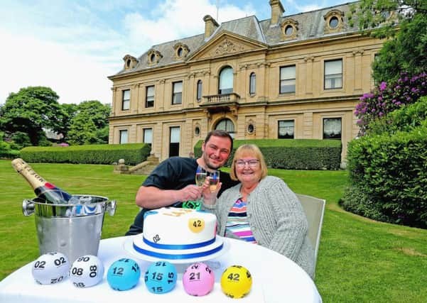 Grandmother Jane Lewis from Halifax celebrates winning a £4.3 million