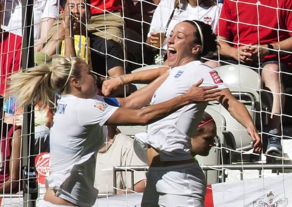 England's Lucy Bronze, right, celebrates her goal with team-mate Steph Houghton.