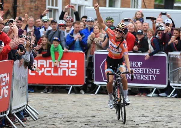 VICTORY SALUTE: Otley rider Lizzie Armitstead celebrates in Lincoln after winning the British Championships road race title. Picture: Nigel French/PA