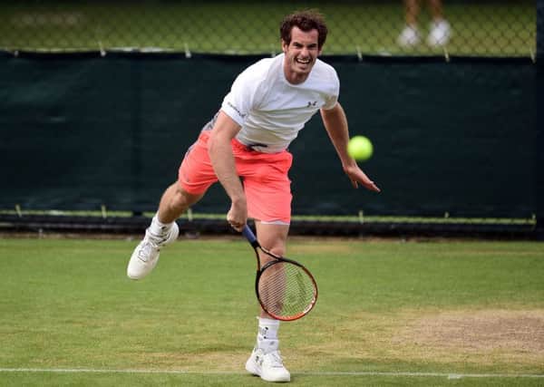 getting ready: Andy Murray, champion two years ago, is pictured practising during yesterdays preview day for the Wimbledon Championships, which start today. Pictures: Adam Davy/PA.