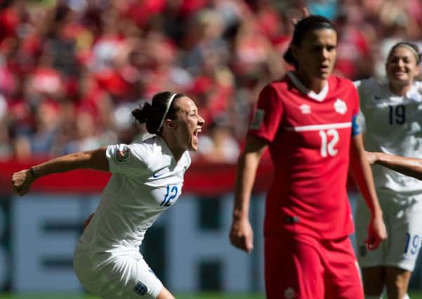 England's Lucy Bronze, left, celebrates her goal against Canada in the Women's World Cup quater-finals (Picture: Darryl Dyck/The Canadian Press via AP).