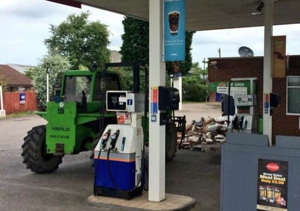 The scene at the petrol station today. Picture: Gerard Tubb