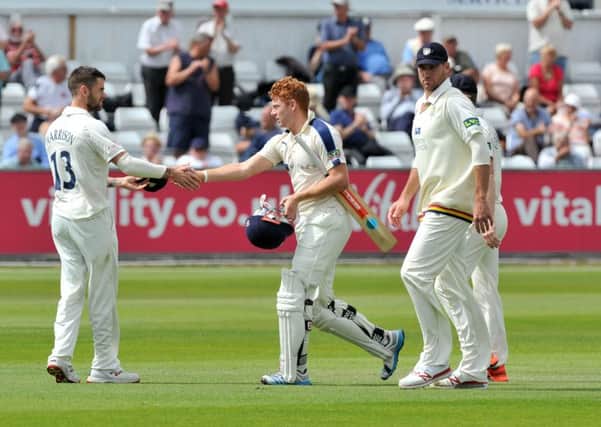 Jonny Bairstow is congratulated on his innings by Durham's Jamie Harrison after Yorkshire declare at 557-6. Picture: Bruce Rollinson