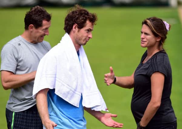 Andy Murray with coaches Jonas Bjorkman (left) and Amelie Mauresmo during practice at Wimbledon on Monday. Picture: Dominic Lipinski/PA.