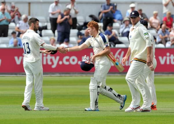 Jonny Bairstow is congratulated on his innings by Durham's Jamie Harrison after Yorkshire declare at 557-6.  Picture: Bruce Rollinson