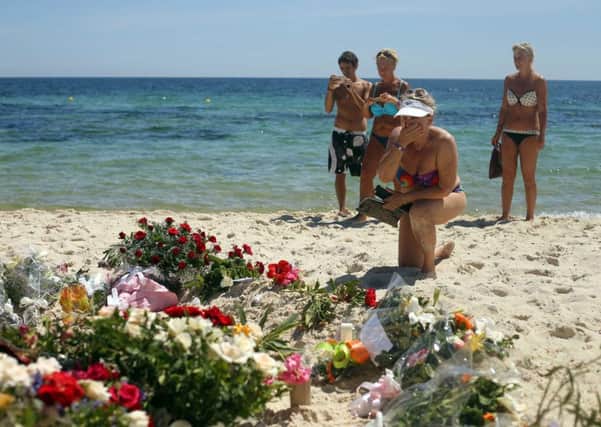 Flowers laid by tourists on the beach near the RIU Imperial Marhaba hotel in Sousse.