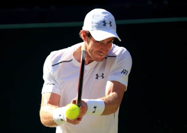 Andy Murray in action against Mikhail Kukushkin at Wimbledon. Picture: Mike Egerton/PA.