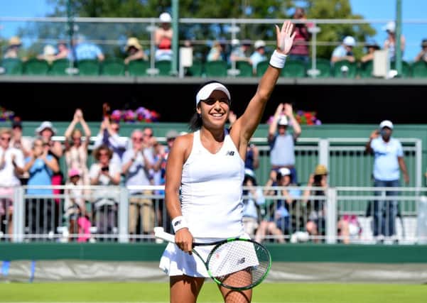 Heather Watson celebrates beating Caroline Garcia in the First round women's singles on day two of the Wimbledon Championships at the All England Lawn Tennis and Croquet Club, Wimbledon. PRESS ASSOCIATION Photo. Picture date: Tuesday June 30, 2015.  See PA Story TENNIS Wimbledon. Photo credit should read Dominic Lipinski/PA Wire. RESTRICTIONS: Editorial use only. No commercial use without prior written consent of the AELTC. Still image use only - no moving images to emulate broadcast. No superimposing or removal of sponsor/ad logos. Call +44 (0)1158 447447 for further information.