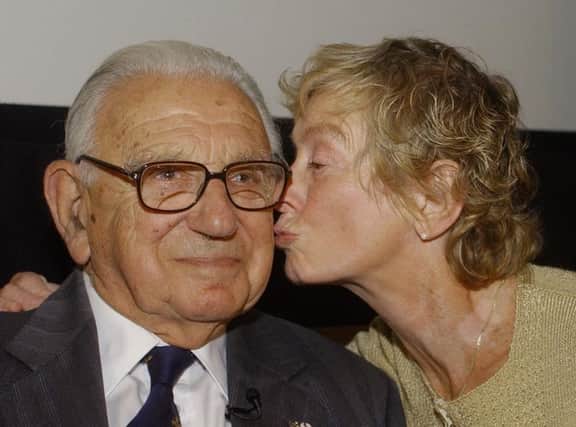 Sir Nicholas Winton gets a kiss on the cheek from Vera Gissingaged 74, who as an 11 year-old was helped by him to escape Prague before the Second World War