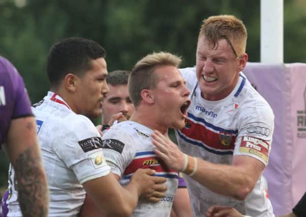 Celebration for Jacob Miller's opening try as Wakefield end long losing run against Hull.