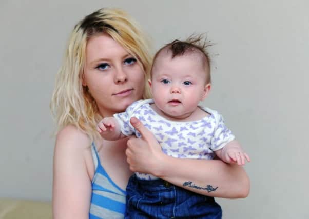 Armley mum Emma Carr with her seven-month-old daughter Laila-Faye Crossley. Picture by Jonathan Gawthorpe.