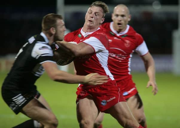 Hull KR's Graeme Horne and Hull FC's Liam Watts battle in the Hull derby.