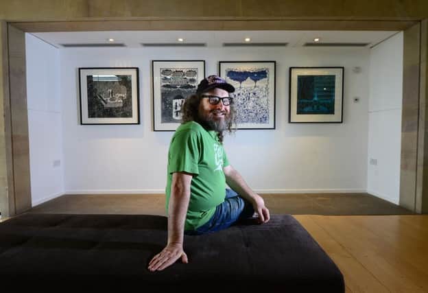 Rob Ryan puts the finishing touches to his solo exhibition, Listen to the World, at the Yorkshire Sculpture Park. Picture: Scott Merrylees