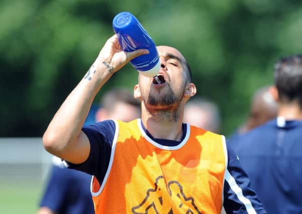 Giuseppe Bellusci has a drink in the hot weather. PIC: Simon Hulme