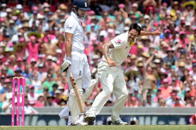 HELLO AGAIN: Australia's Mitchell Johnson (right) celebrates taking the wicket of England's Alastair Cook during day three of the Fifth Test at the Sydney when the great rivals last met in The Ashes. Picture: Anthony Devlin/PA.