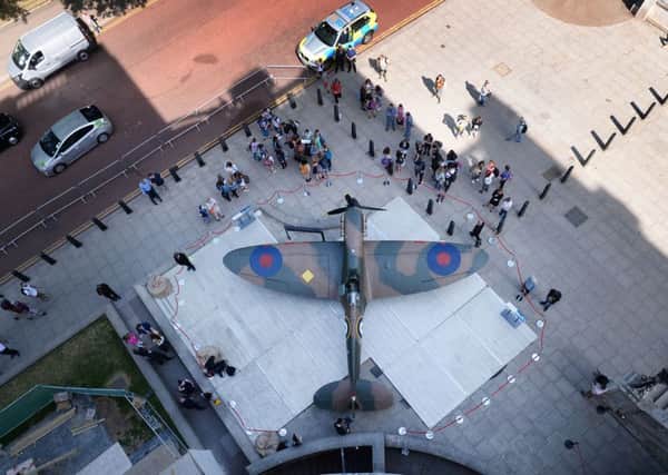 A restored Vickers Supermarine Spitfire Mk.1A is unveiled outside the Churchill War Rooms in central London.