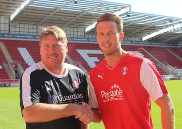 New Rotherham United signing Danny Collins with assistant boss Paul Raynor