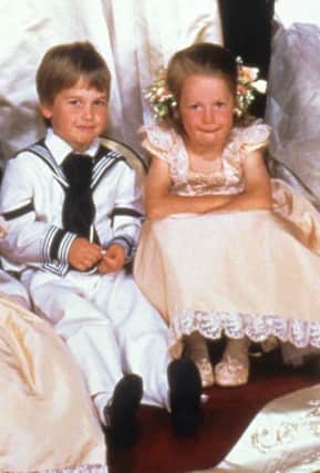 Prince William with his cousin Laura Fellowes, as the Duke and Duchess of Cambridge have chosen Miss Fellowes as one of five godparents for their daughter Princess Charlotte.