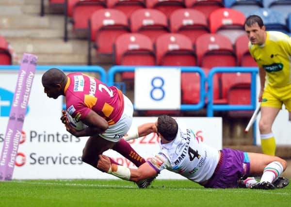 Huddersfield Giants' Jermaine McGillvary scores his side's fifth try against Hull KR. Picture: John Rushworth.