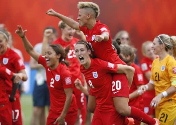 England players celebrate after defeating Germany 1-0 in the FIFA Women's World Cup third-place soccer match in Edmonton, Alberta, Canada. (Jeff McIntosh/The Canadian Press via AP)
