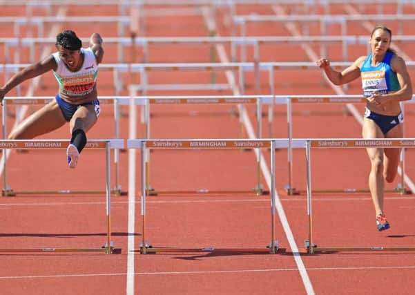 Tiffany Porter (Woodford G Essex L) (centre) wins the women's 100 metres hurdles final ahead of Jessica Ennis-Hill (right) during day one of the Sainsbury's British Championships at The Alexander Stadium, Birmingham. (Picture: Nigel French/PA Wire).