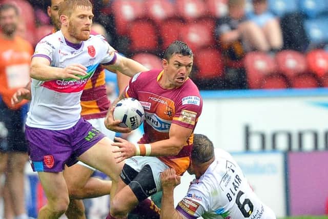 Huddersfield Giants' Danny Brough in action against Hull Kingston Rovers' Kris Welham and Maurice Blair. (Picture: John Rushworth)