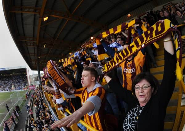 Bradford City fans welcome their team for the FA Cup quarter-final with Reading last season (Picture: Bruce Rollinson).