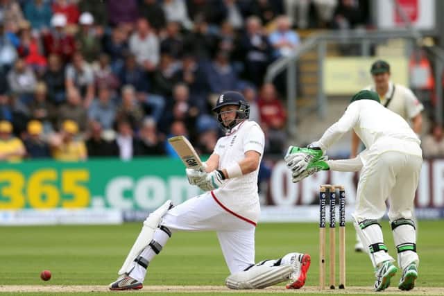 England's Joe Root sweeps for four off Nathan Lyon in Cardiff. Picture: PA.