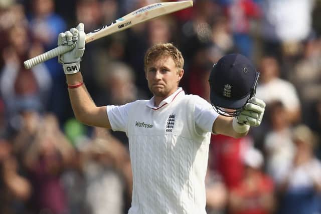 England's Joe Root celebrates after reaching his century.  (Photo by Ryan Pierse/Getty Images)