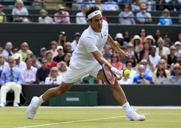 SERVING UP VICTORY: Roger Federer on his way to victory against Gilles Simon in their Wimbledon  quarter-final. Picture: Jonathan Brady/PA