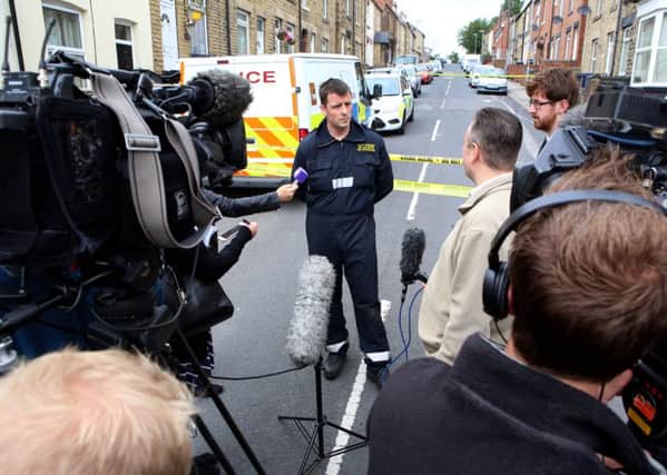 Fire investigation officer Andy Strelczenie makes a statement and speaks with the press, at the scene of the fire on Cherry Tree Street, Elsecar, Barnsley.  Pic: Ross Parry