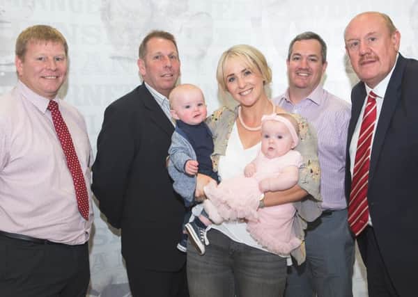 Lizzie Jones with twins Bobby and Phoebe,  flanked by (from left) Jason Donohue (Kingstone Press Championship champions Leigh Centurions), Neil Cullen (League 1 leaders Keighley Cougars), Mike Rush (First Utility Super League champions St Helens) and RFL Chairman Brian Barwick.